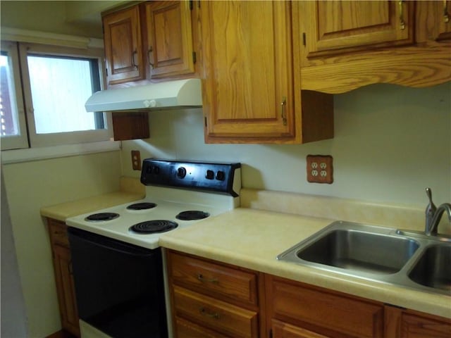 129-131 4th Ave, Scottdale, PA 15683 - kitchen with white range with electric stovetop, ventilation hood, light countertops, and brown cabinets