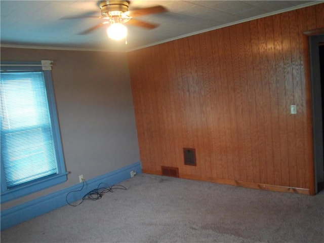 129-131 4th Ave, Scottdale, PA 15683 - spare room featuring carpet, healthy amount of natural light, ceiling fan, wooden walls, and crown molding
