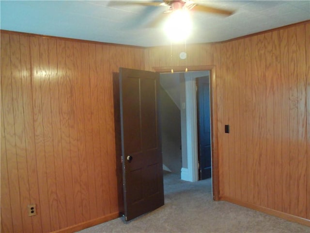 129-131 4th Ave, Scottdale, PA 15683 - spare room featuring ceiling fan, carpet flooring, and wood walls