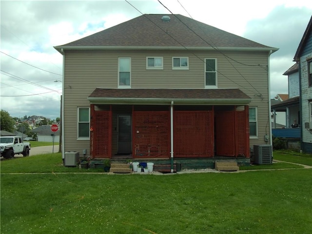129-131 4th Ave, Scottdale, PA 15683 - rear view of house featuring covered porch and a yard