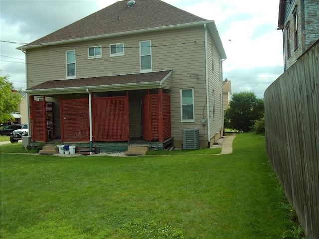 129-131 4th Ave, Scottdale, PA 15683 - rear view of house featuring a lawn