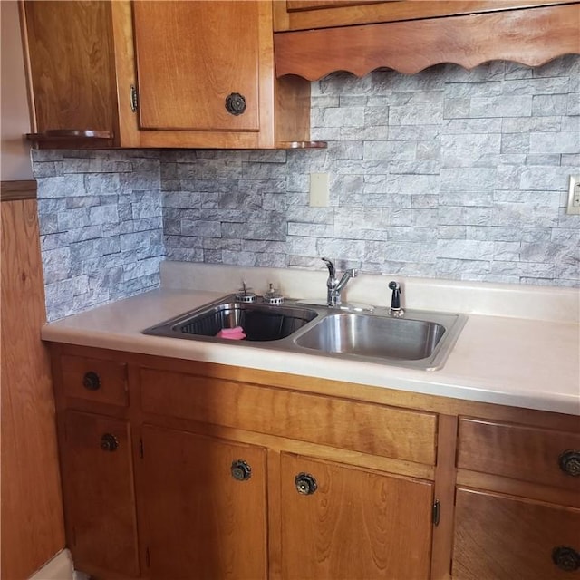 129-131 4th Ave, Scottdale, PA 15683 - kitchen with light countertops, brown cabinets, and backsplash