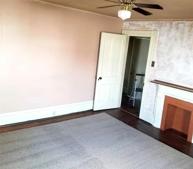 129-131 4th Ave, Scottdale, PA 15683 - unfurnished living room featuring ceiling fan, a fireplace, and dark wood-style flooring