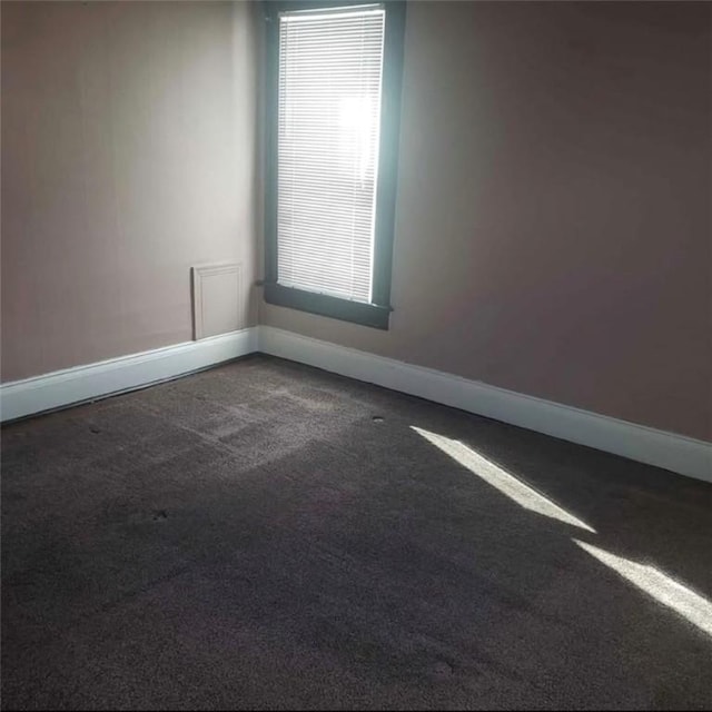 129-131 4th Ave, Scottdale, PA 15683 - carpeted spare room with baseboards