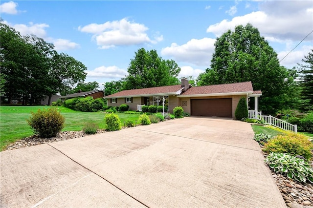 220 N Dr, Center Twp But, PA 16001 - single story home with a garage, concrete driveway, a front lawn, and a chimney