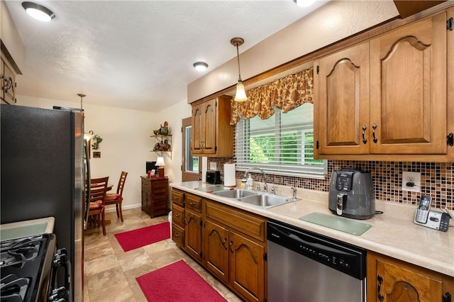 220 N Dr, Center Twp But, PA 16001 - kitchen featuring stainless steel dishwasher, black gas range, brown cabinetry, backsplash, and light countertops
