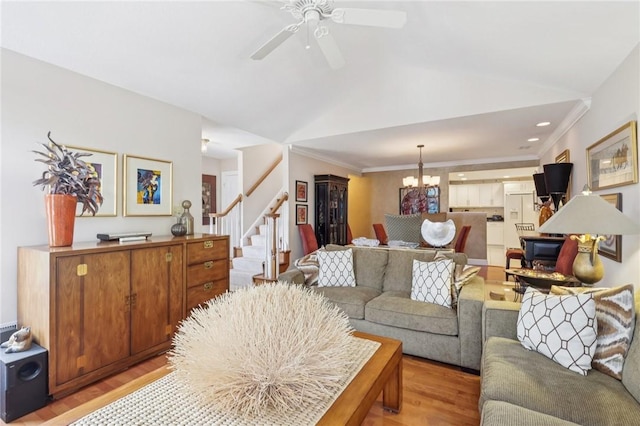 5111 Hemlock, Murrysville, PA 15668 - living area featuring light wood-style floors, stairway, a chandelier, a ceiling fan, and ornamental molding