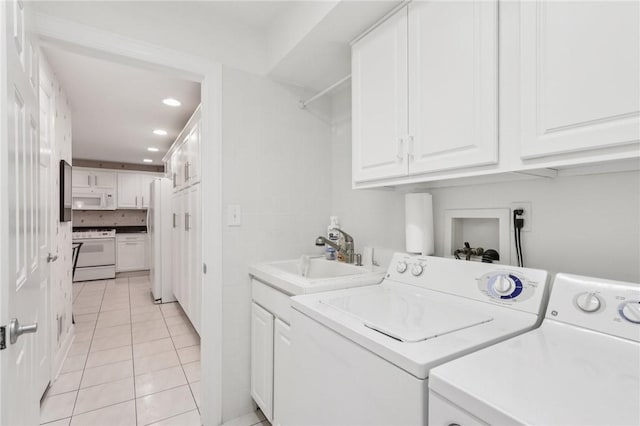 5111 Hemlock, Murrysville, PA 15668 - washroom with light tile patterned floors, washer and clothes dryer, cabinet space, and recessed lighting
