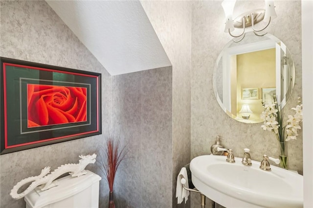 5111 Hemlock, Murrysville, PA 15668 - half bath featuring a chandelier, vaulted ceiling, and wallpapered walls