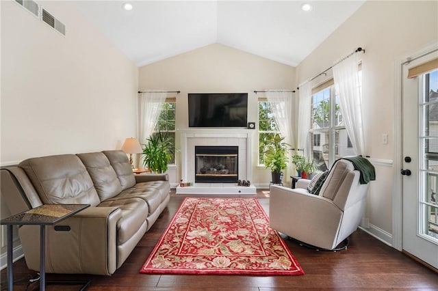 222 Adams Pointe Blvd Unit 1, Adams Twp, PA 16046 - living area with dark wood-style flooring, lofted ceiling, plenty of natural light, a tiled fireplace, and recessed lighting