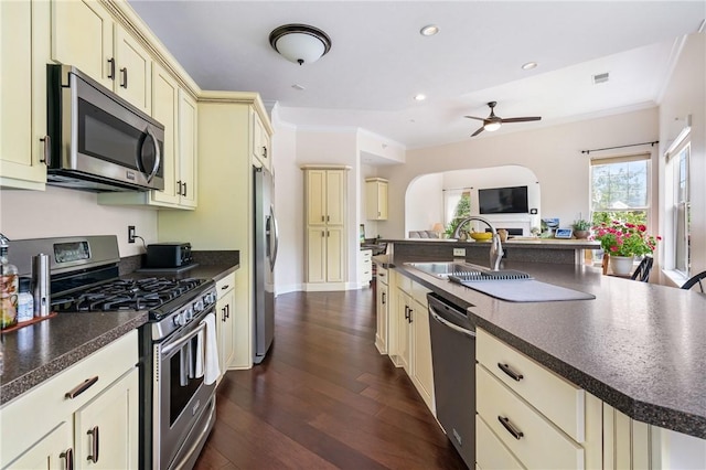 222 Adams Pointe Blvd Unit 1, Adams Twp, PA 16046 - kitchen with cream cabinets, stainless steel appliances, crown molding, dark countertops, and dark wood-style flooring
