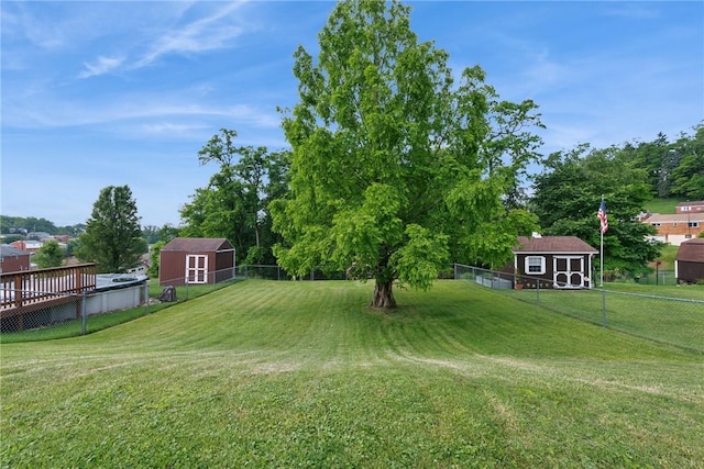 991 Diane Dr N, Versailles, PA 15137 - fenced backyard featuring a storage unit and a wooden deck