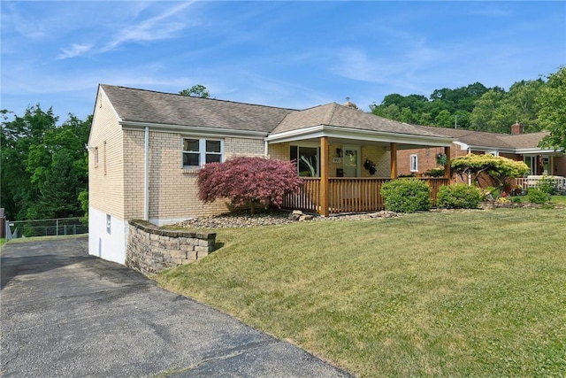 991 Diane Dr N, Versailles, PA 15137 - single story home with brick siding, driveway, a front lawn, and a shingled roof