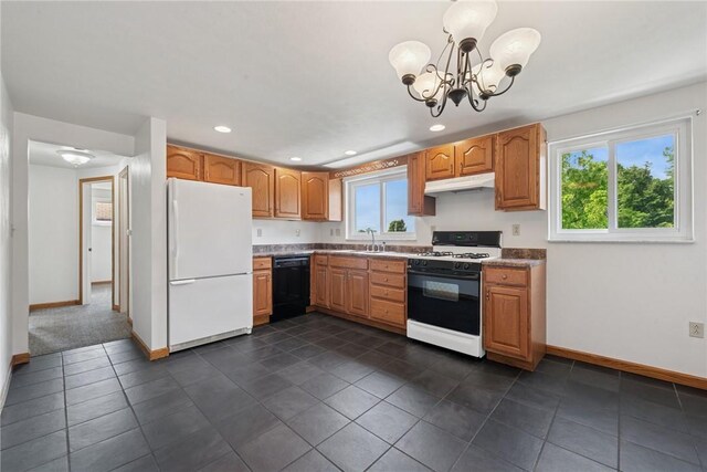 991 Diane Dr N, Versailles, PA 15137 - kitchen featuring white appliances, under cabinet range hood, a chandelier, recessed lighting, and dark tile patterned floors