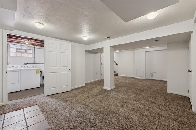 991 Diane Dr N, Versailles, PA 15137 - below grade area with washing machine and dryer, a textured ceiling, carpet flooring, and stairs