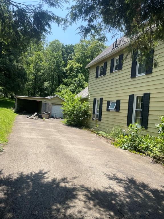 1213 Mccormick Ave, Connellsville, PA 15425 - view of home's exterior featuring a carport