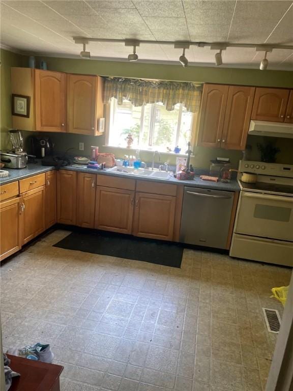 1213 Mccormick Ave, Connellsville, PA 15425 - kitchen featuring stainless steel dishwasher, white range with electric cooktop, track lighting, and under cabinet range hood