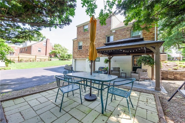 2688 Summit St, Bethel Park, PA 15102 - view of patio / terrace with a gazebo, a garage, an outdoor hangout area, and outdoor dining space