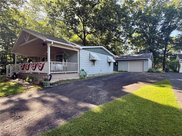 125 Sequoia Dr, Jackson Twp, PA 16137 - view of front facade with driveway, covered porch, an outdoor structure, and a detached garage