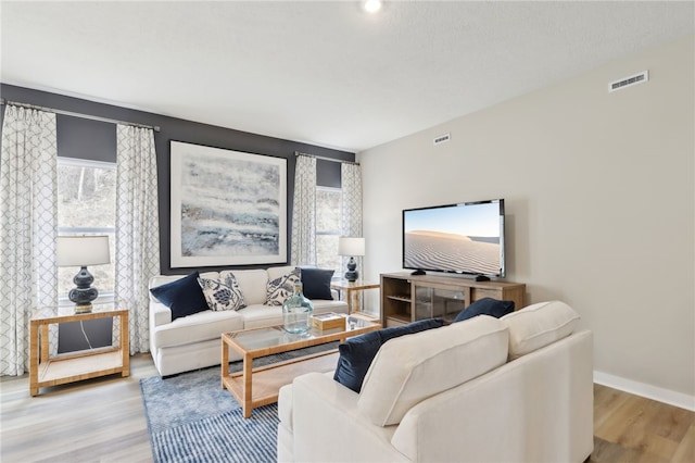 3049 Audrey Dr, Hempfield Twp, PA 15601 - living room featuring light wood-style flooring and baseboards