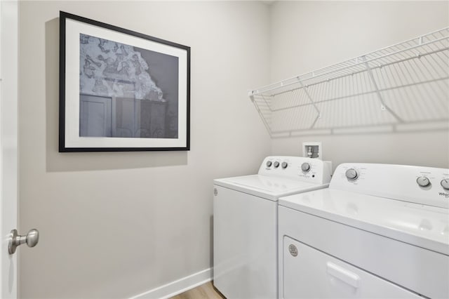 3051 Audrey Dr, Hempfield Twp, PA 15601 - laundry area featuring washing machine and clothes dryer and light wood-type flooring