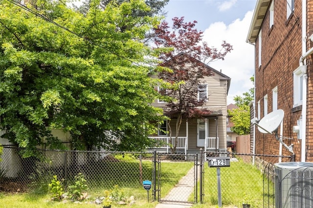 7129 Michigan Ave, Swissvale, PA 15218 - view of front of house featuring covered porch, a gate, and a fenced front yard