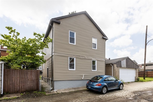 7129 Michigan Ave, Swissvale, PA 15218 - view of property exterior featuring a garage and an outbuilding