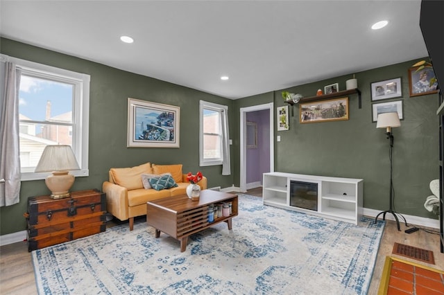 7129 Michigan Ave, Swissvale, PA 15218 - living room featuring plenty of natural light, wood finished floors, and recessed lighting