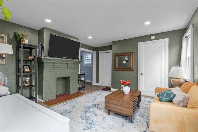 7129 Michigan Ave, Swissvale, PA 15218 - living room with recessed lighting, a fireplace, and wood finished floors