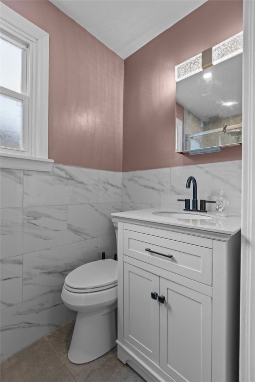 7129 Michigan Ave, Swissvale, PA 15218 - bathroom with tile walls, vanity, and wainscoting