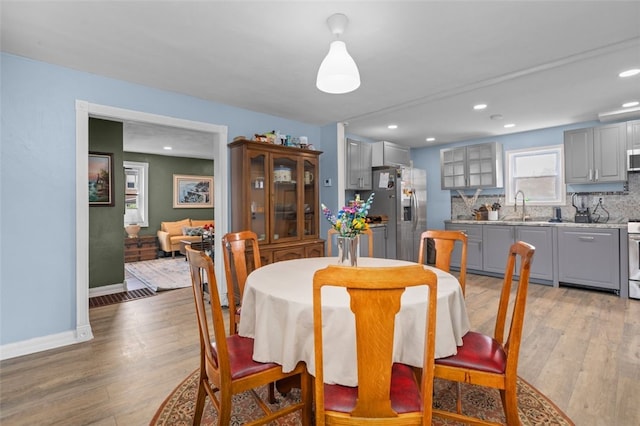 7129 Michigan Ave, Swissvale, PA 15218 - dining area featuring light wood finished floors and recessed lighting