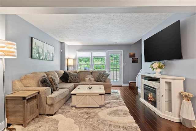 251 Commons Dr, Oakmont, PA 15139 - living area featuring wood finished floors and a glass covered fireplace
