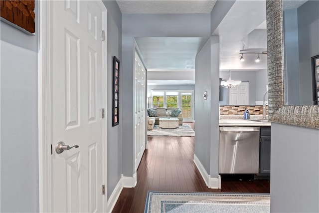 251 Commons Dr, Oakmont, PA 15139 - corridor featuring dark wood-type flooring and a chandelier