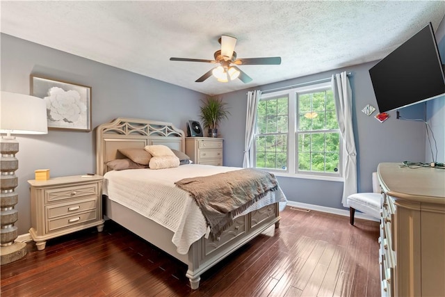 251 Commons Dr, Oakmont, PA 15139 - bedroom featuring dark wood finished floors, a ceiling fan, and a textured ceiling