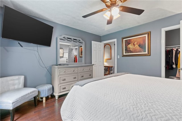 251 Commons Dr, Oakmont, PA 15139 - bedroom with dark wood-type flooring, ceiling fan, a walk in closet, and a closet