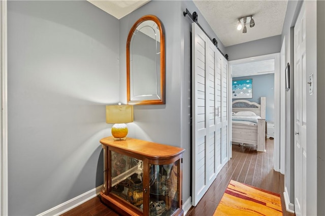 251 Commons Dr, Oakmont, PA 15139 - hall featuring a barn door and wood finished floors