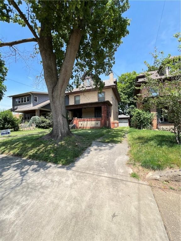 384 E End Ave, Beaver, PA 15009 - view of front of property featuring a chimney, a front yard, and brick siding