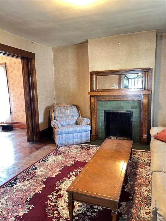 384 E End Ave, Beaver, PA 15009 - living room with a fireplace, wood finished floors, and wallpapered walls