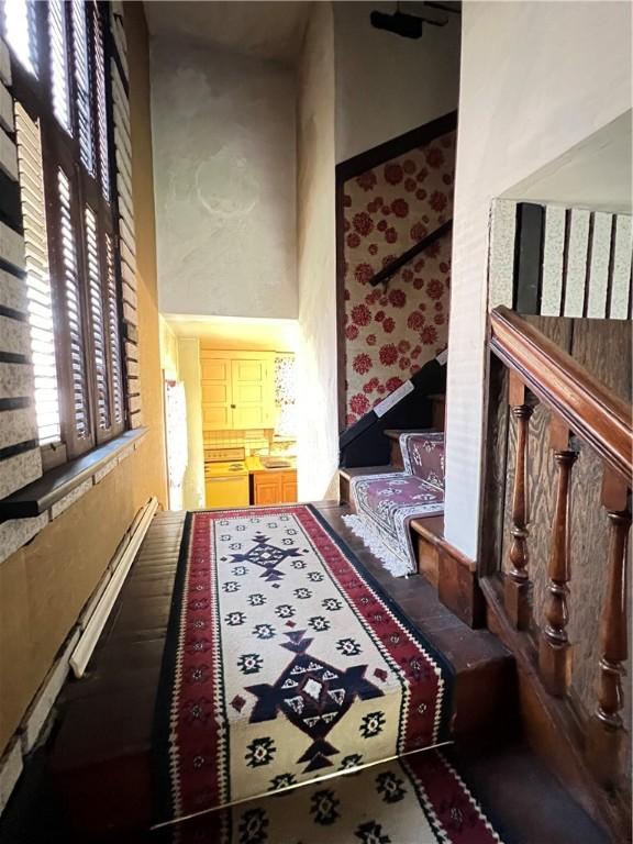 384 E End Ave, Beaver, PA 15009 - corridor featuring stairs, a high ceiling, and wallpapered walls