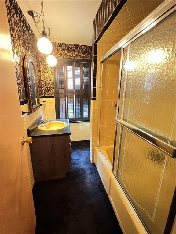 384 E End Ave, Beaver, PA 15009 - full bathroom featuring tile walls, vanity, enclosed tub / shower combo, and wainscoting