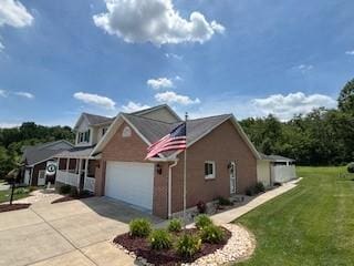2355 School St, Mount Pleasant Twp Wml, PA 15666 - view of property exterior with driveway, a yard, and a garage