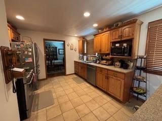 2355 School St, Mount Pleasant Twp Wml, PA 15666 - kitchen featuring dishwashing machine, recessed lighting, light tile patterned floors, and brown cabinetry