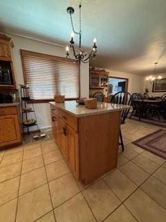 2355 School St, Mount Pleasant Twp Wml, PA 15666 - kitchen with a chandelier, light tile patterned flooring, and a kitchen bar