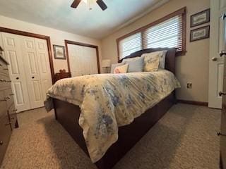 2355 School St, Mount Pleasant Twp Wml, PA 15666 - bedroom featuring multiple closets, a ceiling fan, and carpet floors