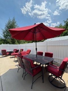 2355 School St, Mount Pleasant Twp Wml, PA 15666 - fenced backyard featuring a patio area and outdoor dining area