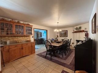 2355 School St, Mount Pleasant Twp Wml, PA 15666 - dining room with a chandelier and light tile patterned flooring