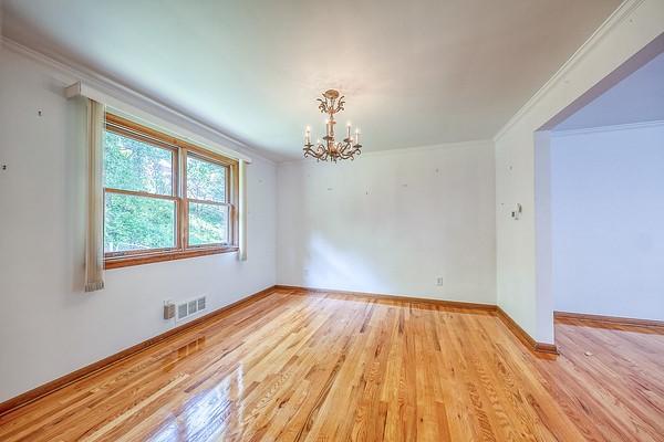 4517 W Brightview Ave, Whitehall, PA 15227 - spare room featuring a chandelier, ornamental molding, and wood finished floors