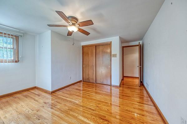4517 W Brightview Ave, Whitehall, PA 15227 - unfurnished bedroom with light wood-style floors, a closet, and a ceiling fan