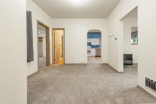 407 Hill St, Grove City Boro, PA 16127 - spare room with arched walkways, carpet, and a textured ceiling