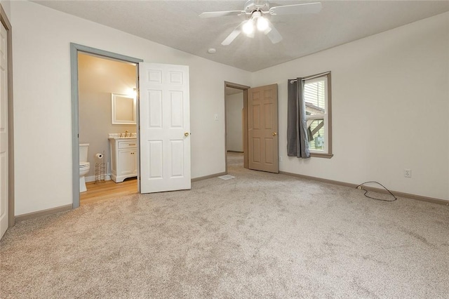 407 Hill St, Grove City Boro, PA 16127 - unfurnished bedroom featuring light carpet, ensuite bath, and a ceiling fan